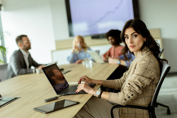 istock Radiant professional woman excels during a dynamic office meeting in bright workspace 2150994262