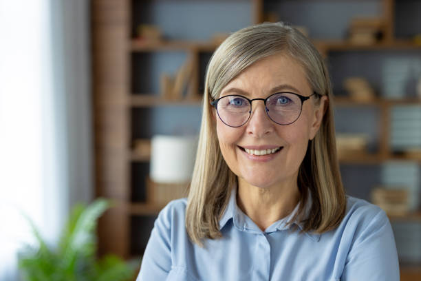istock Confident senior businesswoman smiling in office setting 2150998006