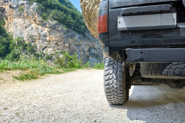 istock SUV wheel with deep tread in the mountains. 2150998704