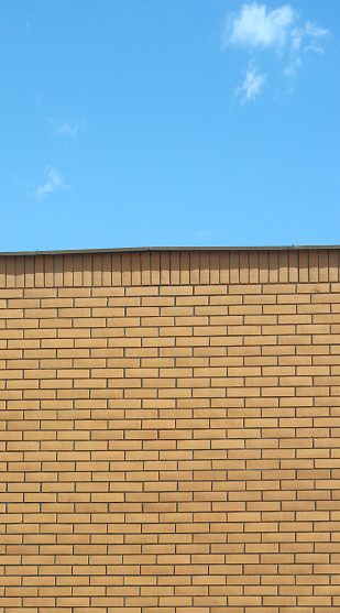 This is a facade wall made of bricks.