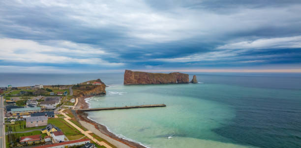 istock Town on the Atlantic Ocean Coast during a cloudy sunset. Perce, Quebec, Canada. 2150999820