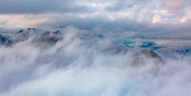istock Dramatic Mountain Landscape covered in clouds. Aerial Nature Background 2150999856