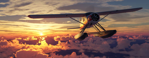 istock Airplane flying over mountains, lakes, and clouds. Sunny Da 2150999862