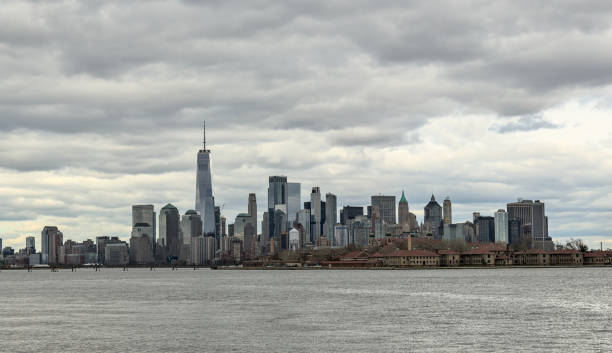 istock downtown manhattan skyline on a cloudy day (world trade center) one skyscraper tall buildings (financial center) hudson river, liberty state park view new york city nyc metropolis cityscape 2151001140