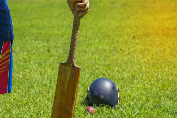 Cricket bat and ball on white background with England flag