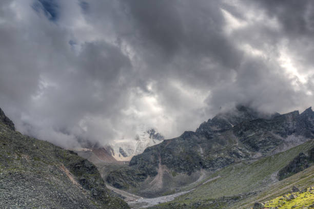Low dark clouds float over the mountains.
