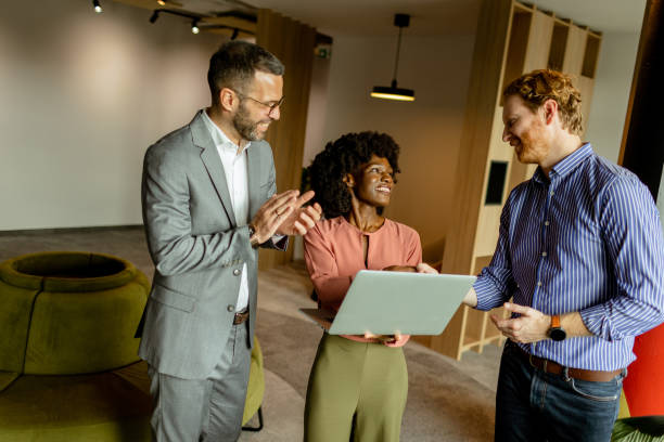 istock Creative team engaging in a lively brainstorming session at a colorful office space 2151003629
