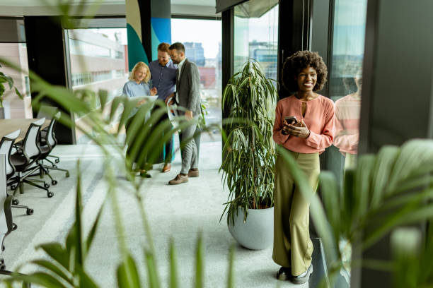 Radiant smile and casual networking in a modern office environment at midday