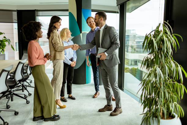 istock A warm handshake welcome during a sunny morning office gathering 2151003666