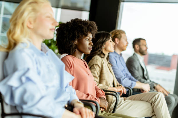 istock Energetic applause by a diverse group at a casual indoor event 2151003673