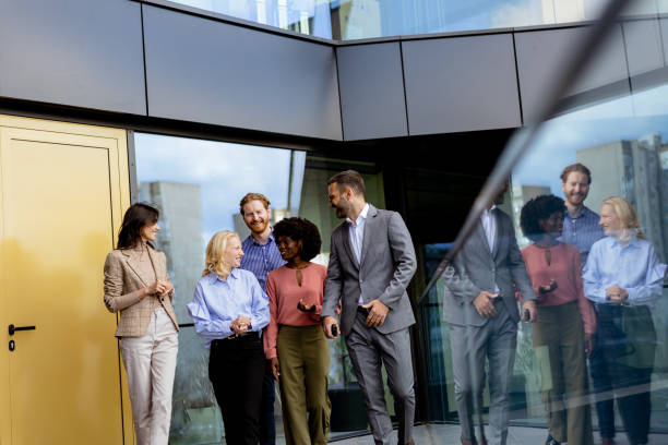 istock Casual Networking Event at Office, Professionals Mingling in Modern Glass Building. 2151003756