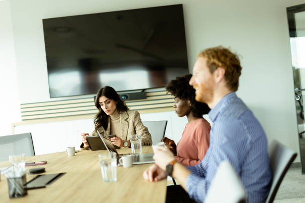 istock Diverse team engaging in strategic planning during bright daytime office meeting 2151003770