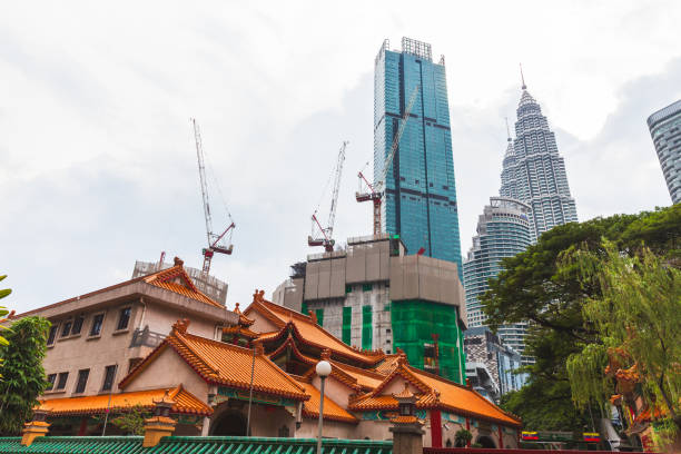 Kuala Lumpur, Malaysia - November 25, 2019: Kuala Lumpur downtown, street view with modern buildings under construction on the background