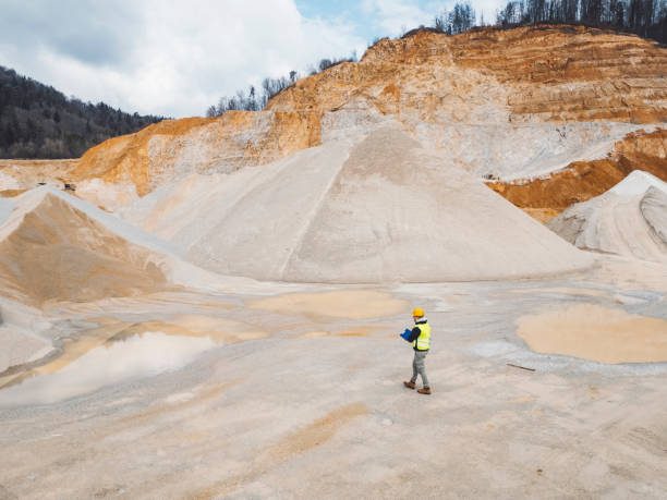 Inspector standing on quarry grounds, checking out the site