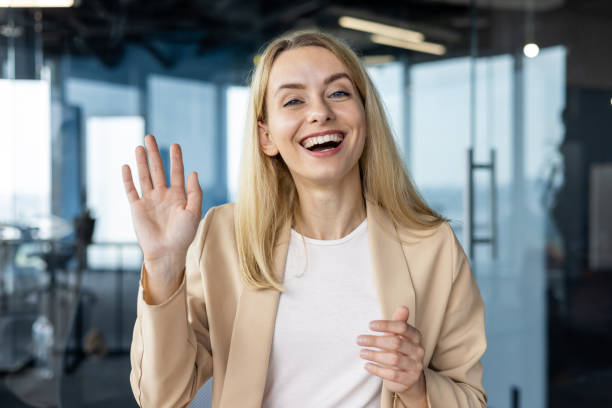istock Professional woman greeting on a video call in modern office 2151005361