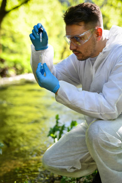 istock Modern Male Scientist Taking River Water For Research 2151006151
