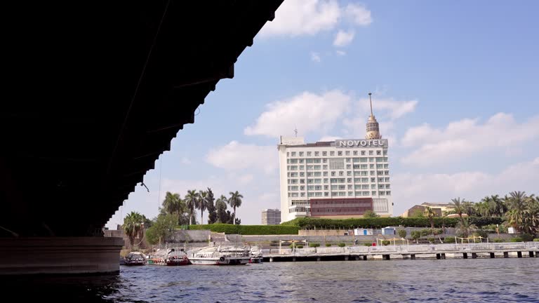 View From The Tour Boat Passing Under The Bridge On The Nile River With The Cityscape Of Cairo
