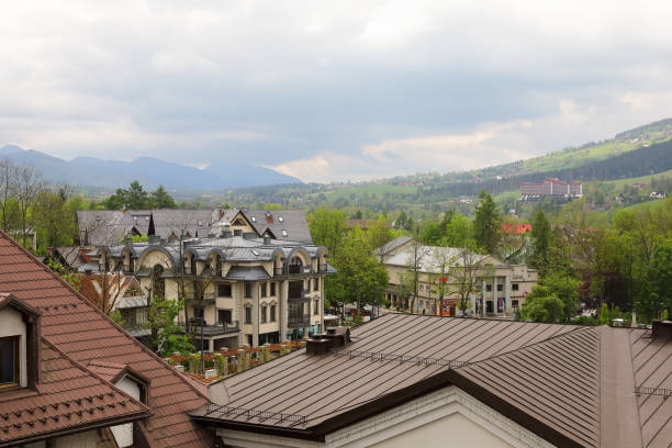 Zakopane, Poland - June 01, 2019: Among other buildings there is a modern residential building.