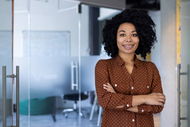 istock Confident young businesswoman smiling in modern office 2151008279