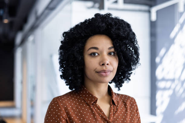 istock Confident young businesswoman in a modern office setting 2151009335