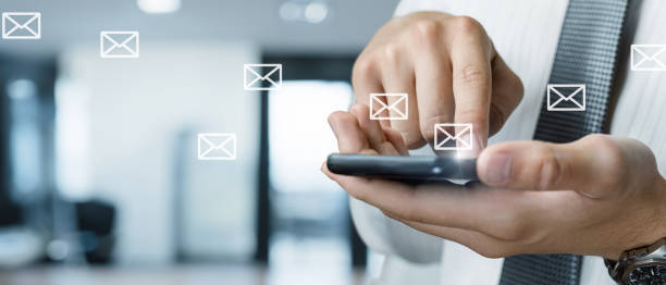 istock A businessman sends emails from his phone. 2151009717