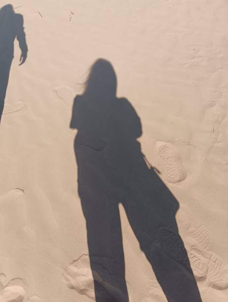 istock Photo of person's shadow on desert 2151010637