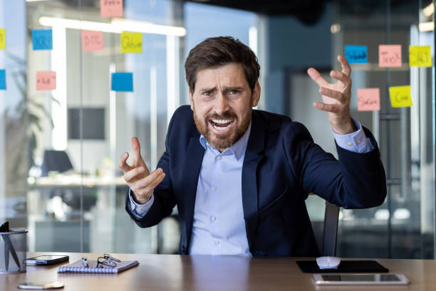 istock Angry businessman arguing during a tense office meeting 2151013547