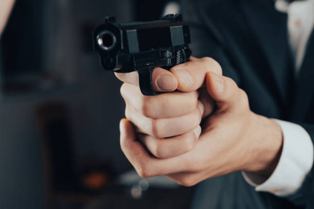 istock A man in a suit pointed a gun 2151014939