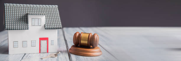 istock house model with judge gavel 2151015387