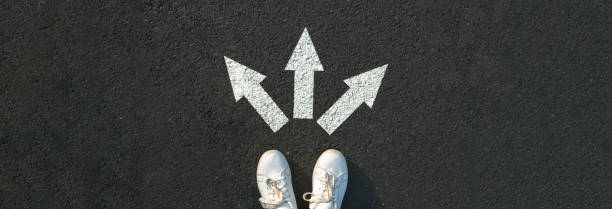 istock Woman standing near arrows 2151015425