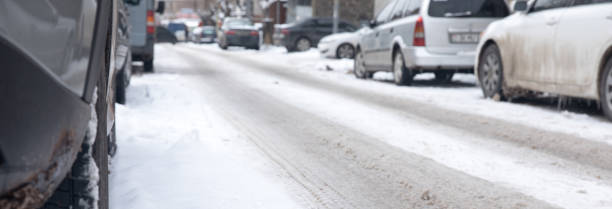 Parked cars with snowy road