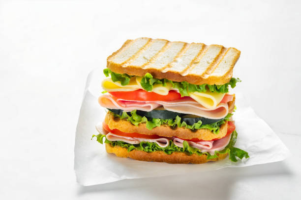 istock Big sandwich with vegetables and ham copy space 2151016535