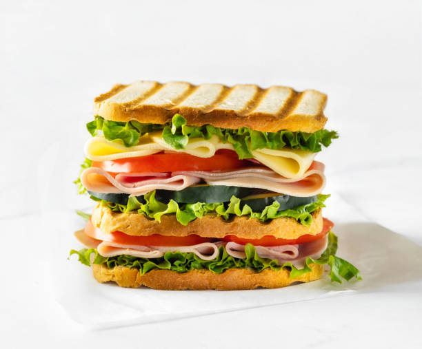 istock Big sandwich with vegetables and ham close up 2151016697