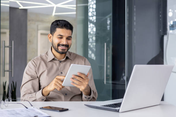 istock Professional working with tablet and laptop in modern office 2151017677