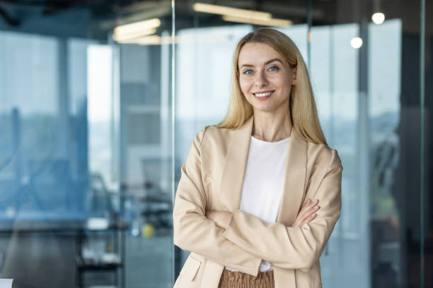 istock Confident businesswoman smiling in modern office setting 2151019421