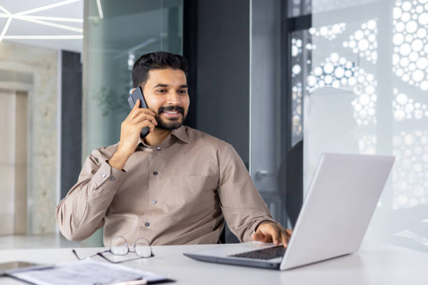 istock Professional businessman working and making a phone call in office 2151020358