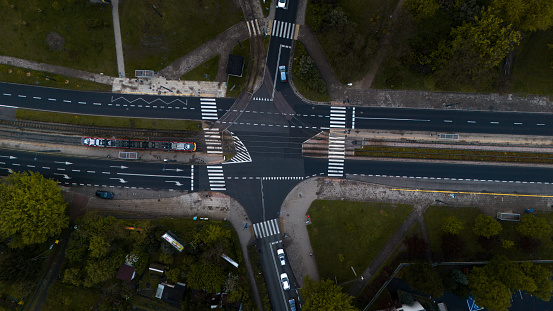 road junction with tram aerial view at sunset