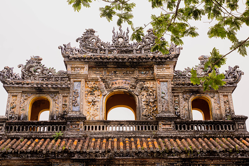 Oriental red monument in Imperial City, Hue. Ruins in Citadel famous landmark of Vietnam.