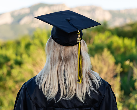 Read image of a teen girl in a graduation cap