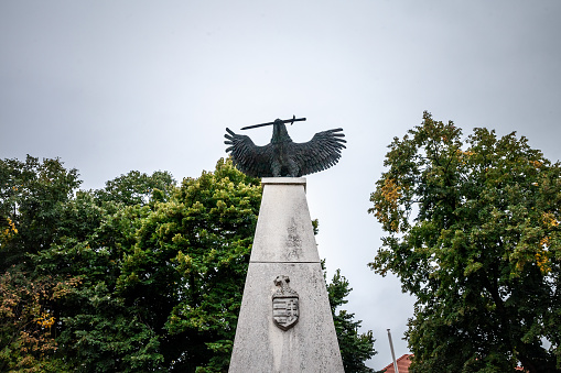 Villany, Hungary - September 25, 2023: Picture of the memorial to the 1st and 2nd World War memorial, called I. es II. Vilaghaborus Emlekmu. Designed by Lauber Laszlo in 1924, it's dedicated to people who died in the two world wars from Villany, Hungary.