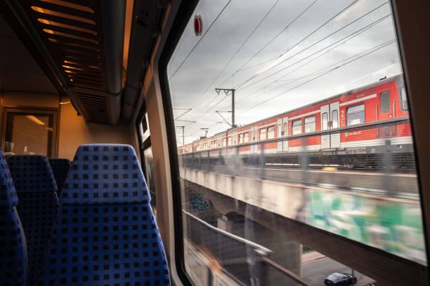 Cologne, Germany - November 7, 2022: Picture of a typical seat from a European german train, empty, ready for a suburban service in Cologne, typical from Europe, in a modern regional EMU train on a Koln S-Bahn EMU train in Cologne. The Rhine-Ruhr S-Bahn (German: S-Bahn Rhein-Ruhr) is a polycentric and electrically driven S-bahn network covering the Rhine-Ruhr Metropolitan Region in the German federated state of North Rhine-Westphalia. This includes most of the Ruhr (and cities such as Dortmund, Duisburg and Essen), the Berg cities of Wuppertal and Solingen and parts of the Rhineland (with cities such as Cologne and Düsseldorf). The easternmost city within the S-Bahn Rhine-Ruhr network is Unna, the westernmost city served is Mönchengladbach.