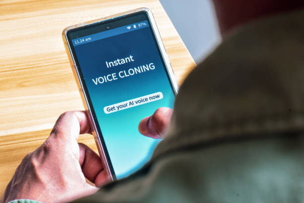 istock Man using Voice Cloning applications on his smartphone to create AI voice. The danger and benefits of artificial intelligence use concepts. 2151030518