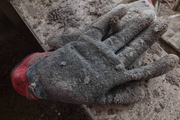 istock Old and diiirty leather gloves on house construction. 2151031551