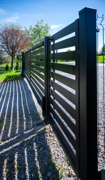 istock Modern black sliding gate at a residential entrance 2151032701