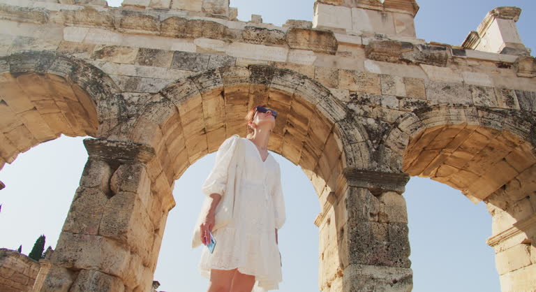 Traveler explores the ruins of the ancient city Hierapolis