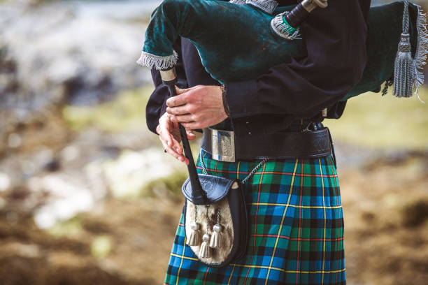 istock A man wearing a kilt and holding a pipe 2151040605