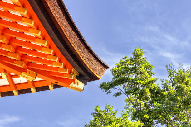 Kyoto, Japan - October 10th, 2023: Detailed Close-up view of the decorative red Kiyomizu-dera Pagoda under a blue autumn sky in Kyoto Japan.