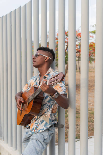 istock Serene Guitarist Enjoying a Peaceful Urban Session 2151044410
