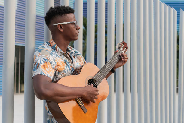 istock Focused Guitar Player in Urban Environment 2151044413