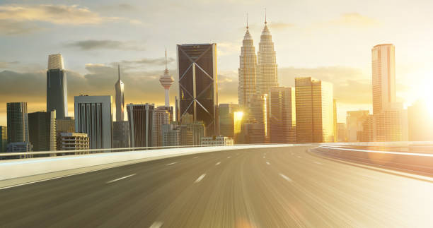 istock Sunset cityscape with urban highway 2151044420